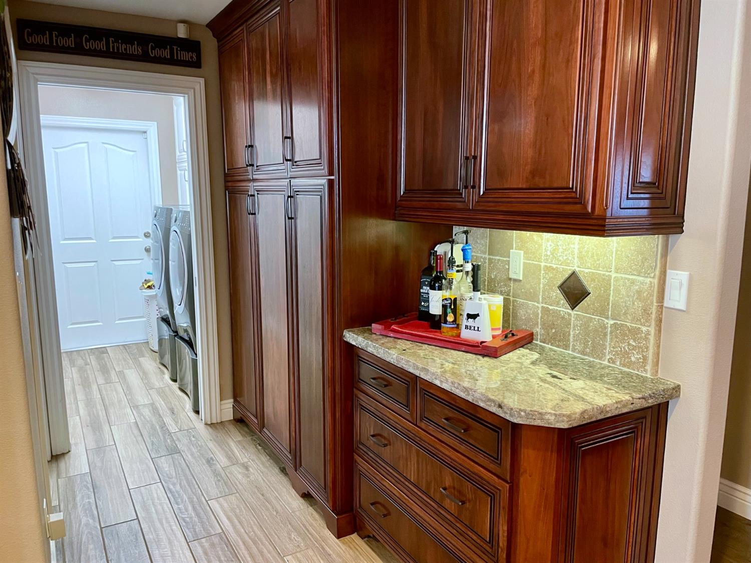 16760 West Hanford Armona Road Lemoore, CA 93245 - Photo 13 of 36 a kitchen with granite countertop wood cabinets and stainless steel appliances