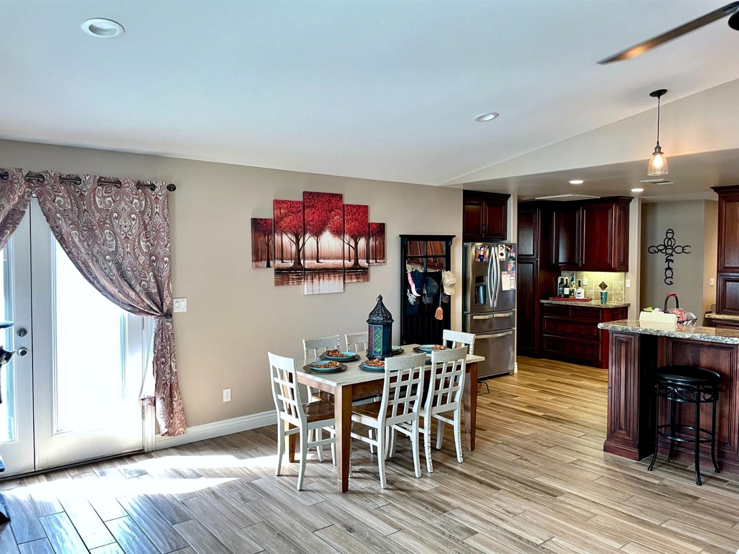16760 West Hanford Armona Road Lemoore, CA 93245 - Photo 15 of 36 a view of a dining room with furniture and wooden floor