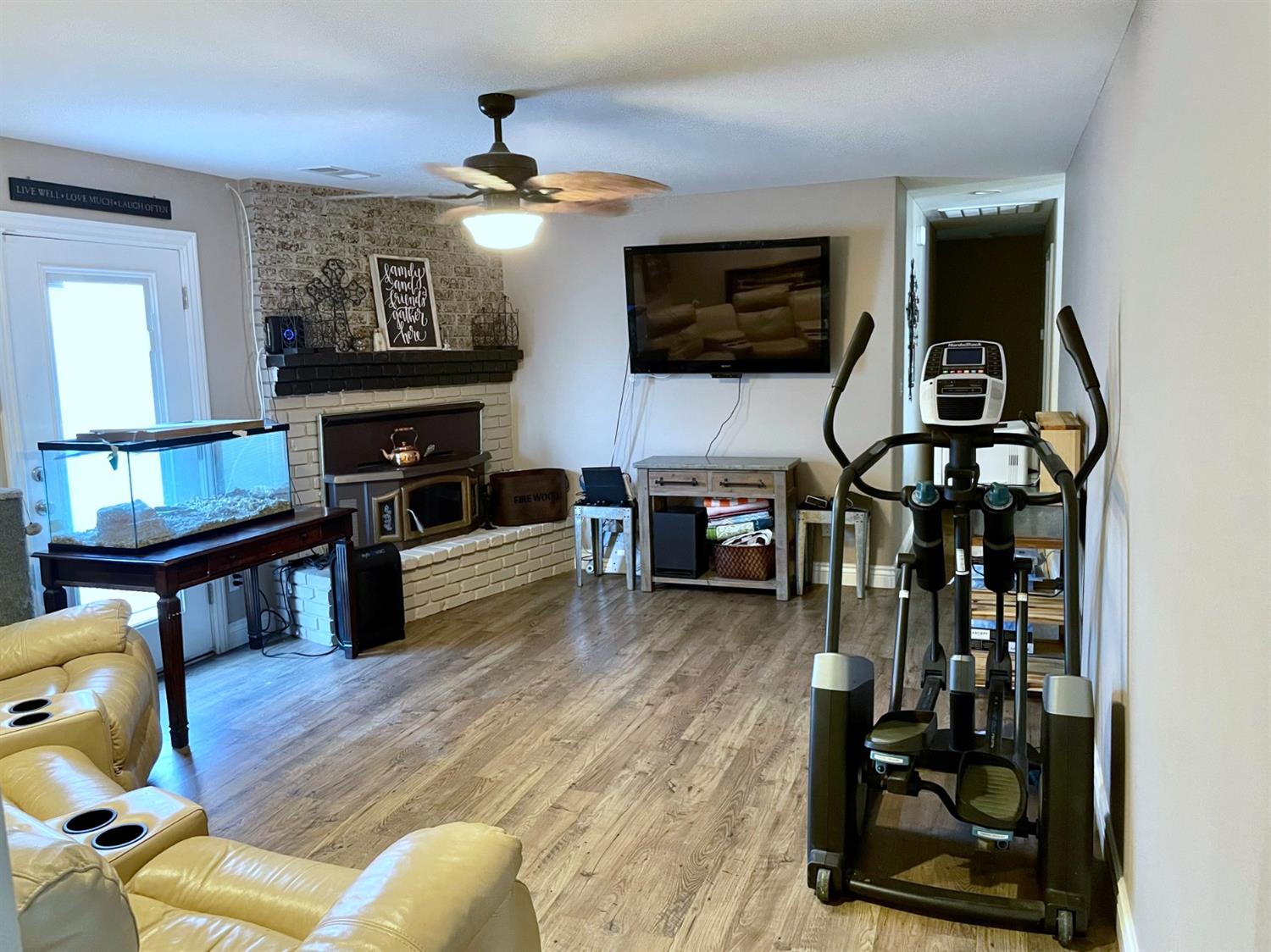 16760 West Hanford Armona Road Lemoore, CA 93245 - Photo 18 of 36 a living room with furniture and a flat screen tv