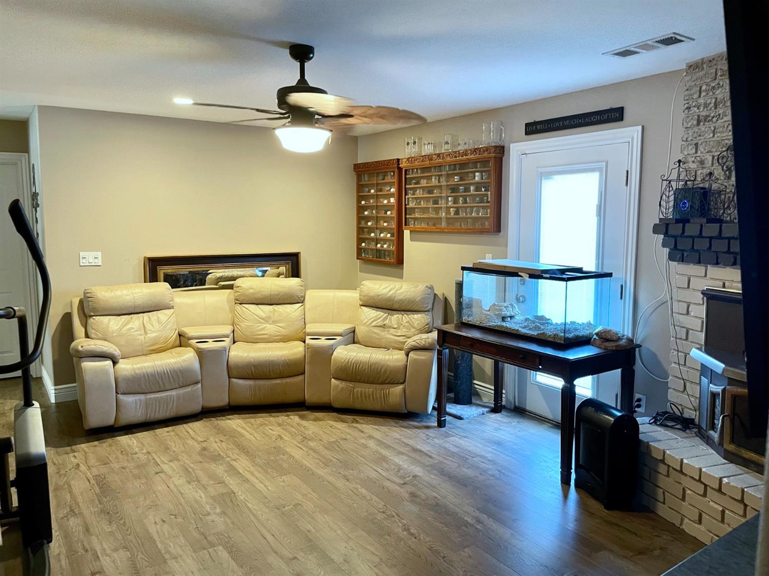 16760 West Hanford Armona Road Lemoore, CA 93245 - Photo 19 of 36 a living room with furniture a lamp wooden floor and a window