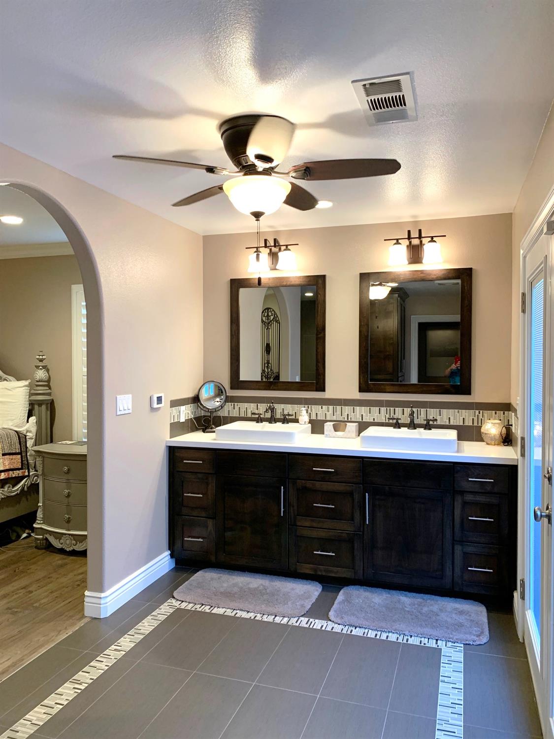 16760 West Hanford Armona Road Lemoore, CA 93245 - Photo 26 of 36 a bathroom with a sink and a large mirror