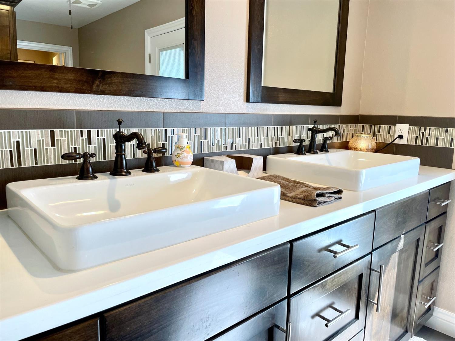 16760 West Hanford Armona Road Lemoore, CA 93245 - Photo 27 of 36 a bathroom with a sink and a mirror