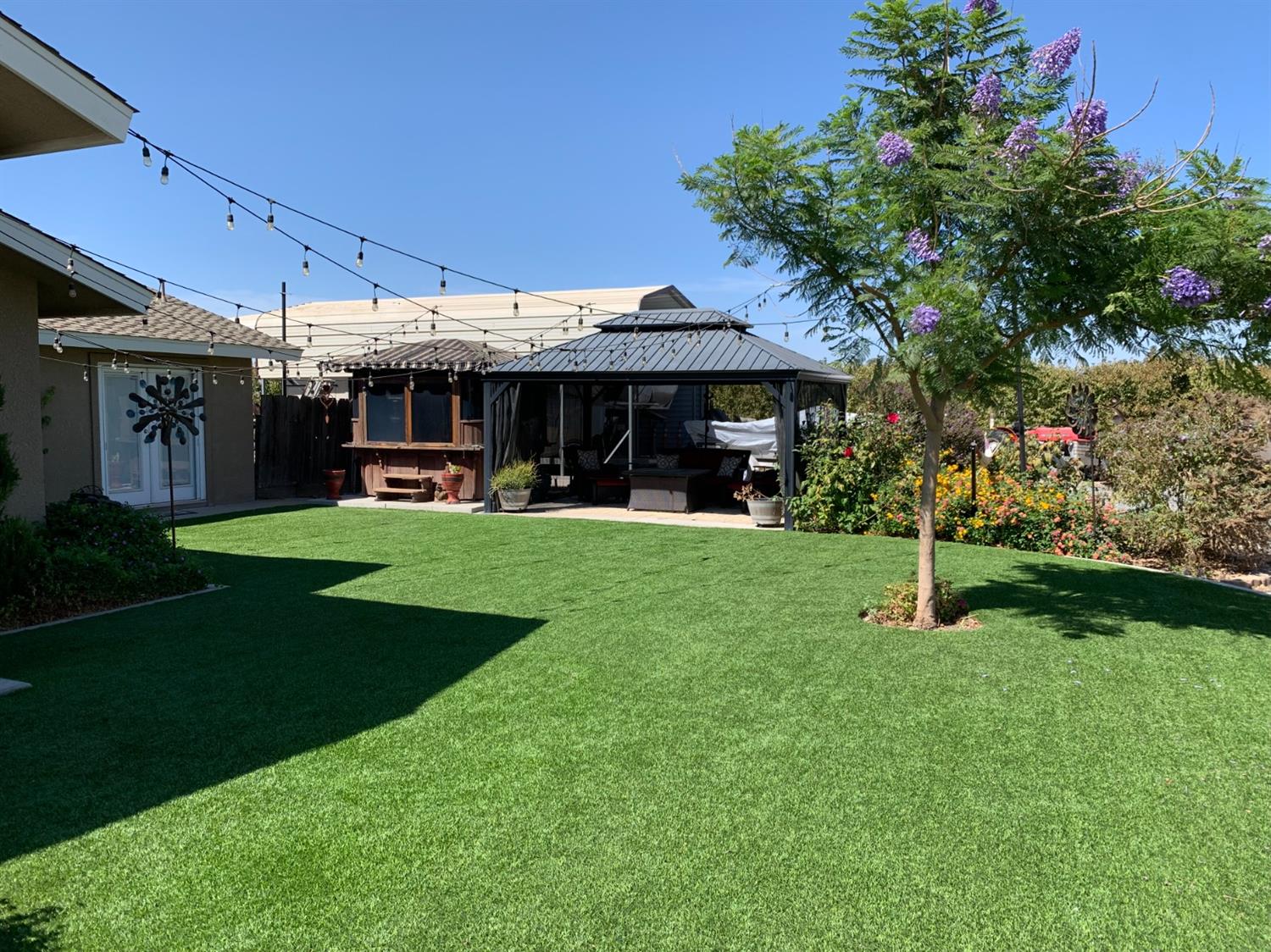 16760 West Hanford Armona Road Lemoore, CA 93245 - Photo 7 of 36 a view of a chairs and table in the garden