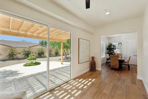 a living room with furniture and kitchen view
