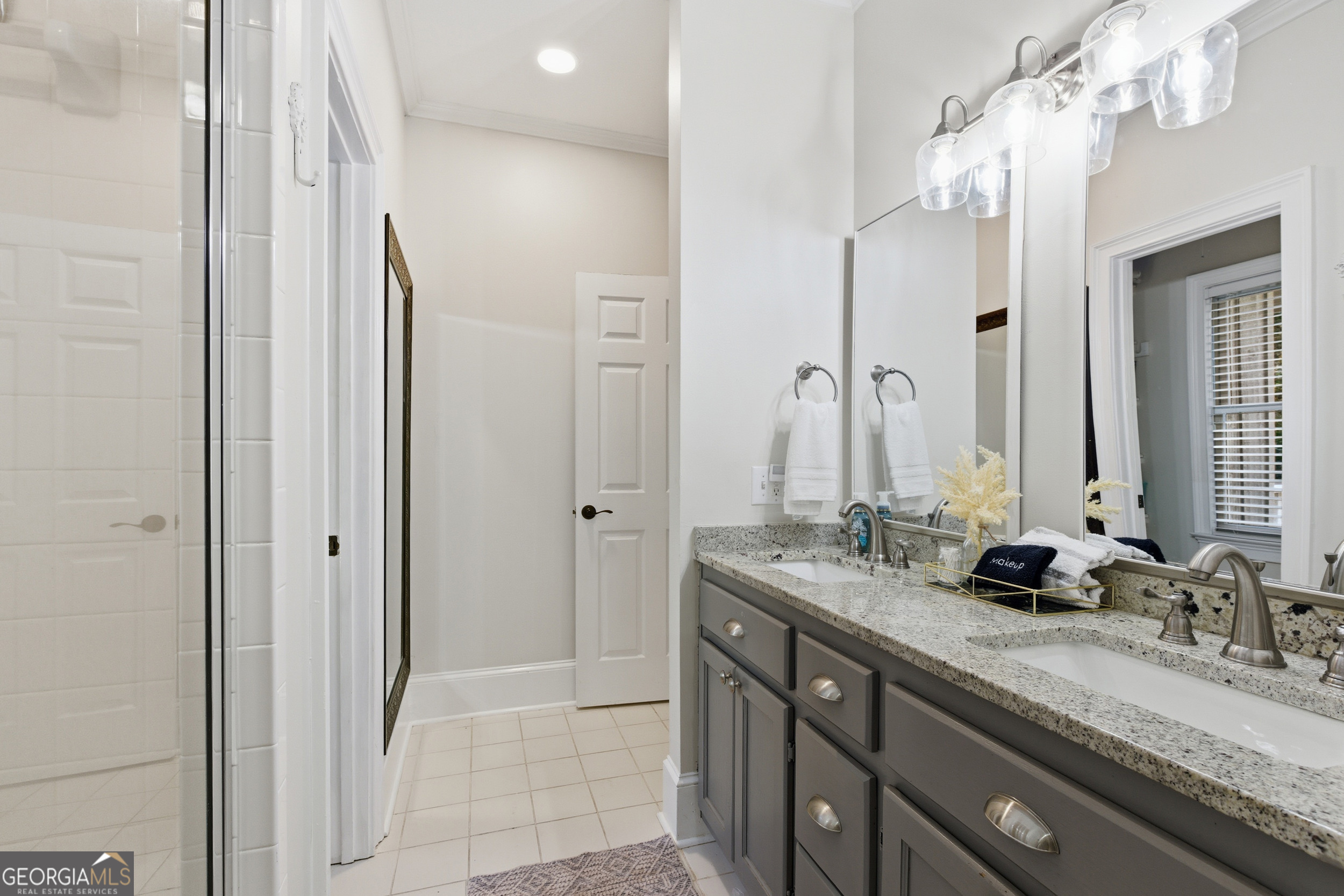 478 Chattahoochee Glen Road Clarkesville, GA 30523 - Photo 20 of 58 a bathroom with double vanity sinks and a mirror