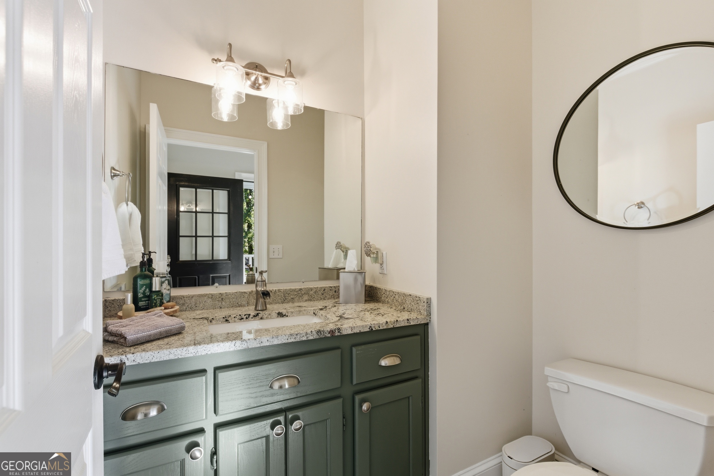 478 Chattahoochee Glen Road Clarkesville, GA 30523 - Photo 22 of 58 a bathroom with a toilet a sink and mirror