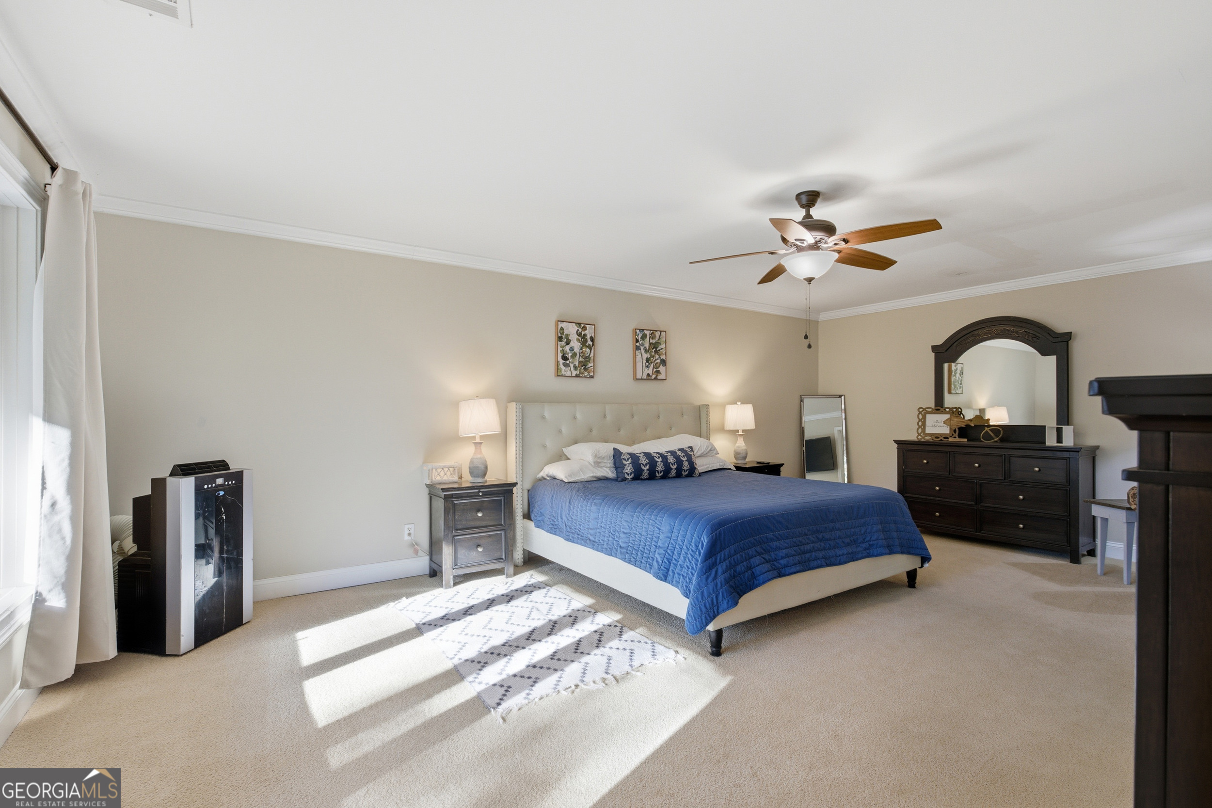 478 Chattahoochee Glen Road Clarkesville, GA 30523 - Photo 36 of 58 a bedroom with a bed and a chandelier
