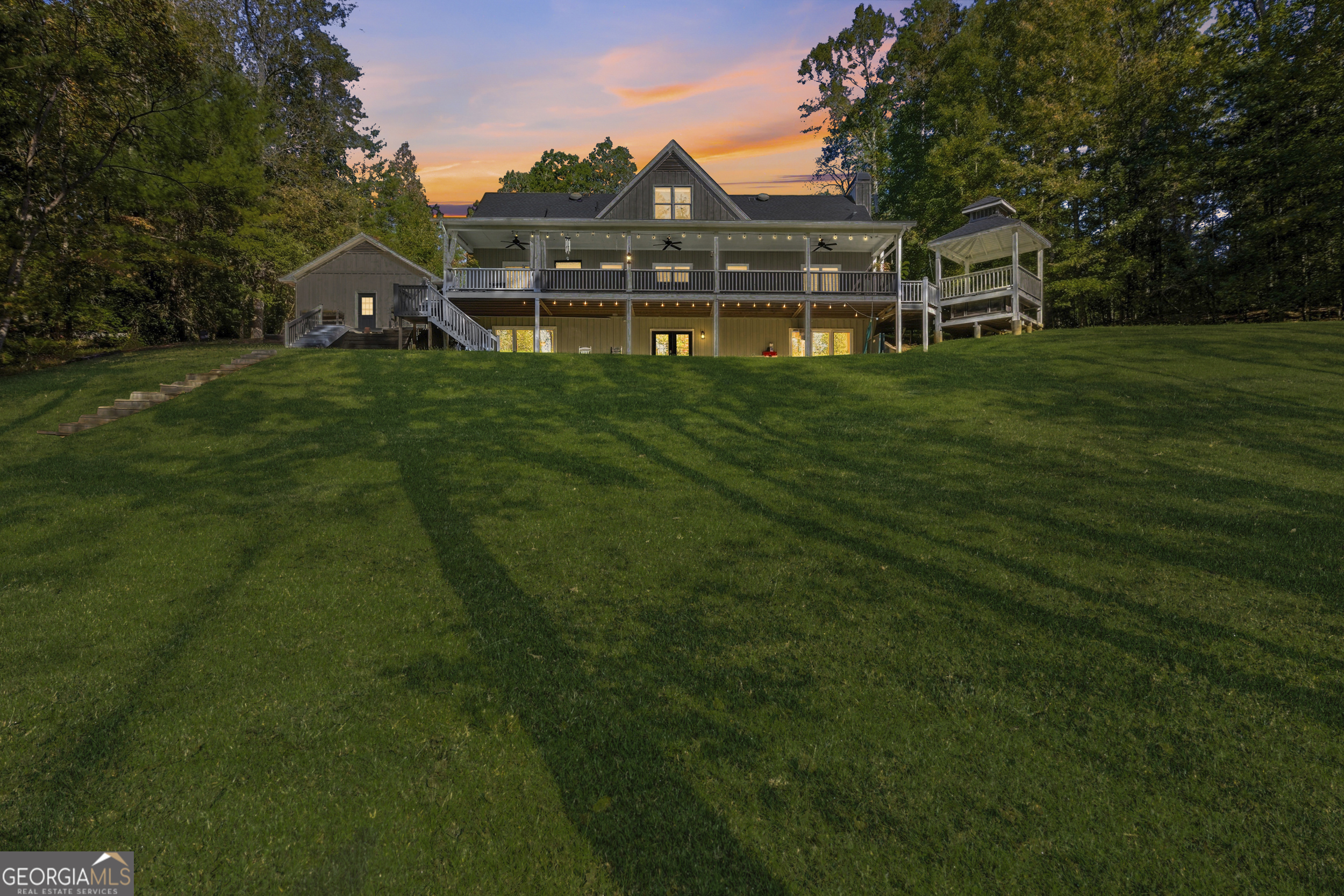 478 Chattahoochee Glen Road Clarkesville, GA 30523 - Photo 5 of 58 a view of a house with a big yard and large trees