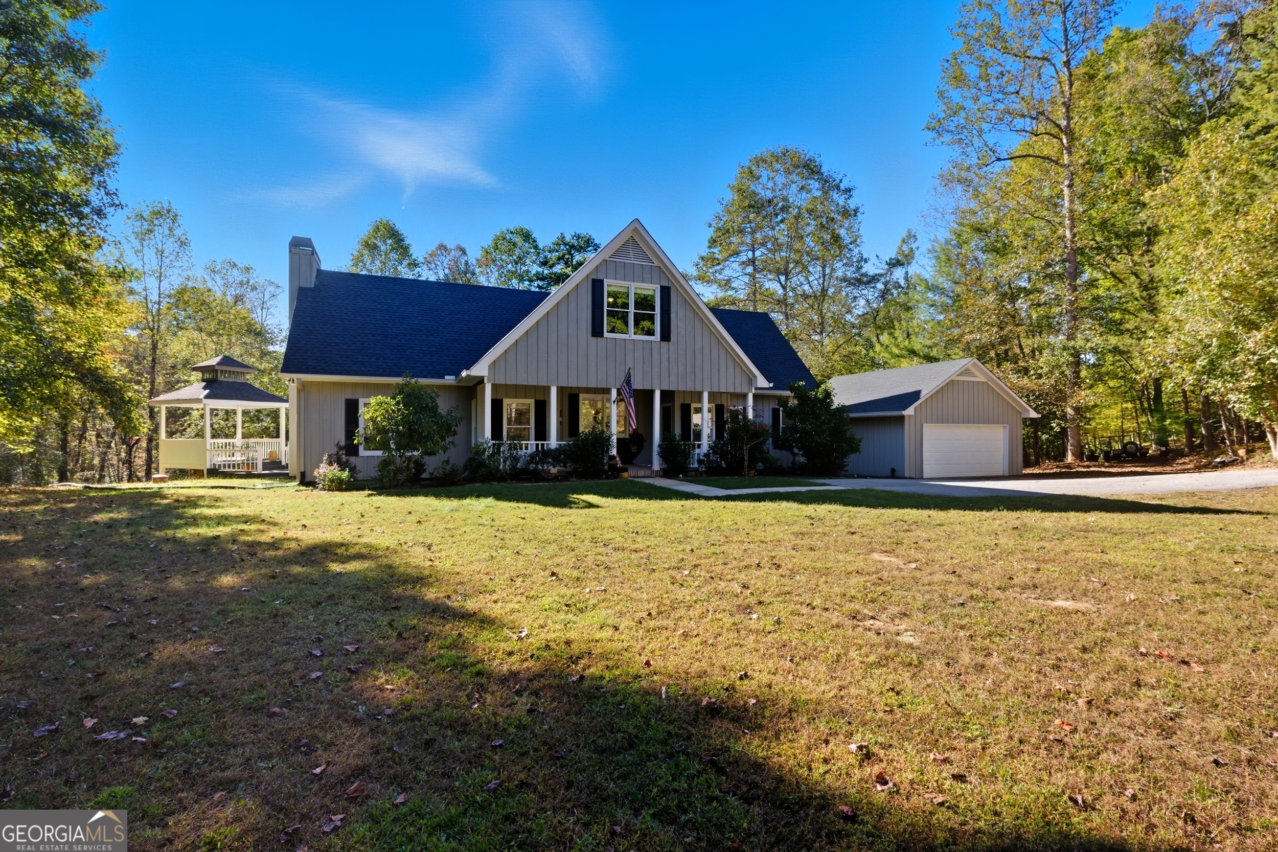 478 Chattahoochee Glen Road Clarkesville, GA 30523 - Photo 8 of 58 a front view of a house with a yard