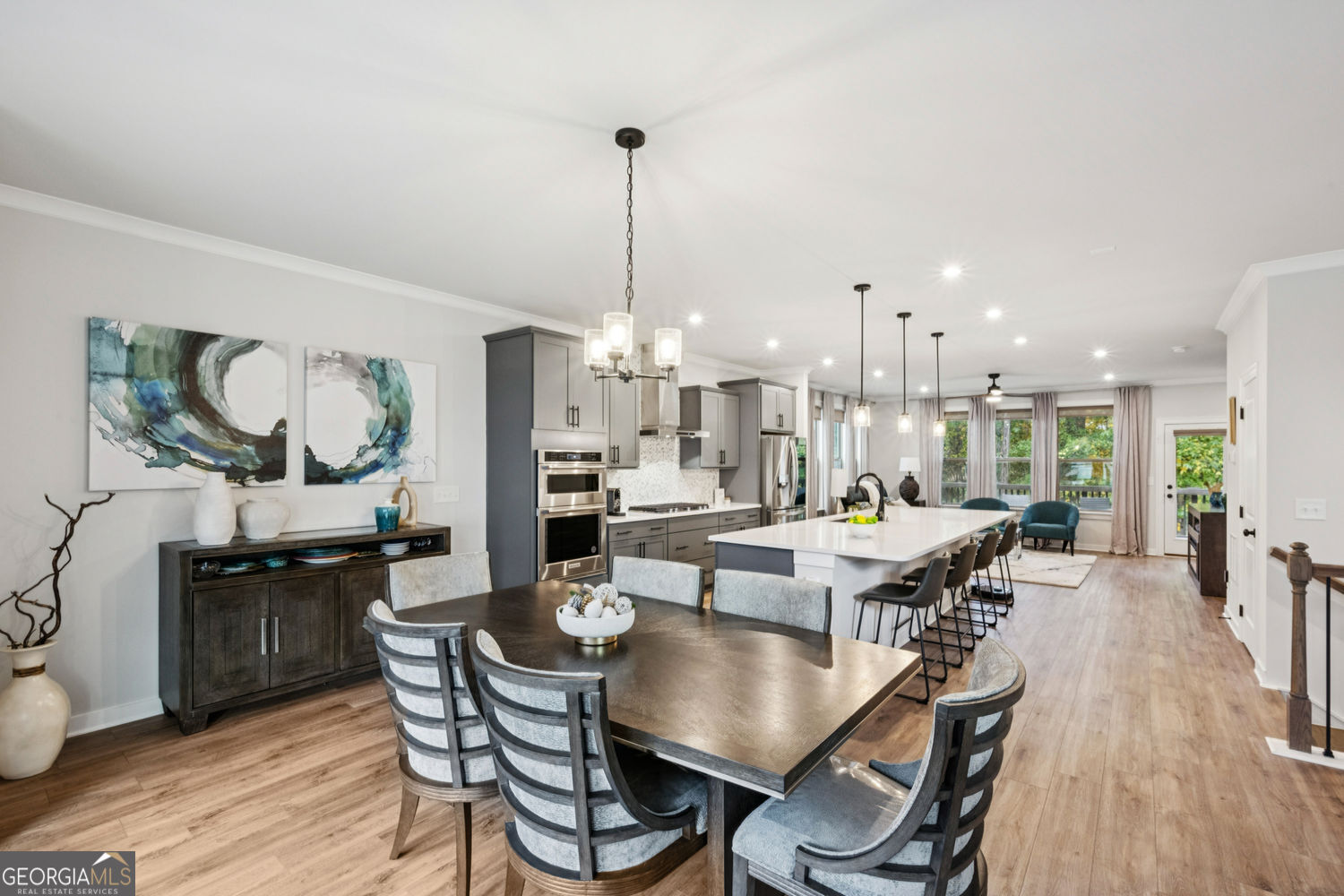 a view of a dining room with furniture window and wooden floor