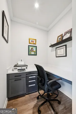 a bathroom with a granite countertop sink toilet and a mirror