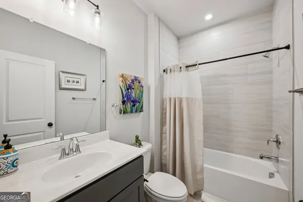 a front view of a building with a window and a ceiling fan