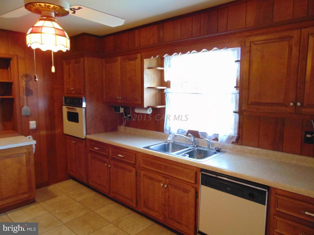 32848 Perryhawkin Road Princess Anne, MD 21853 - Photo 14 of 48 a kitchen with a sink and a window