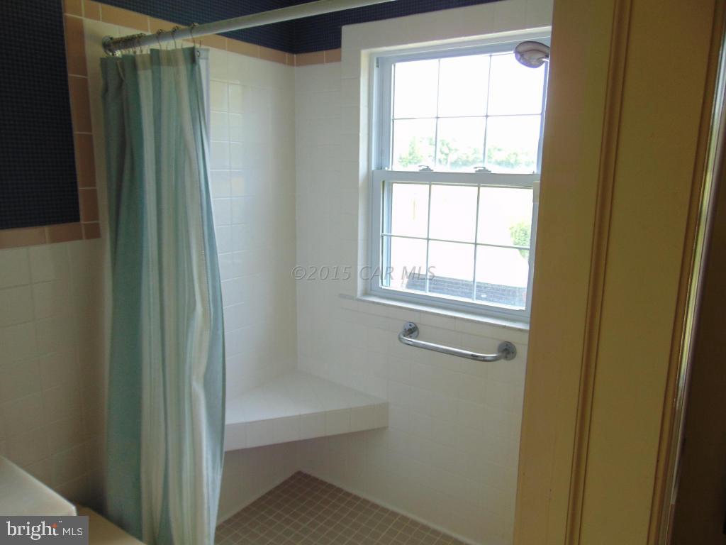 32848 Perryhawkin Road Princess Anne, MD 21853 - Photo 22 of 48 a view of a small space with wooden floor and a window