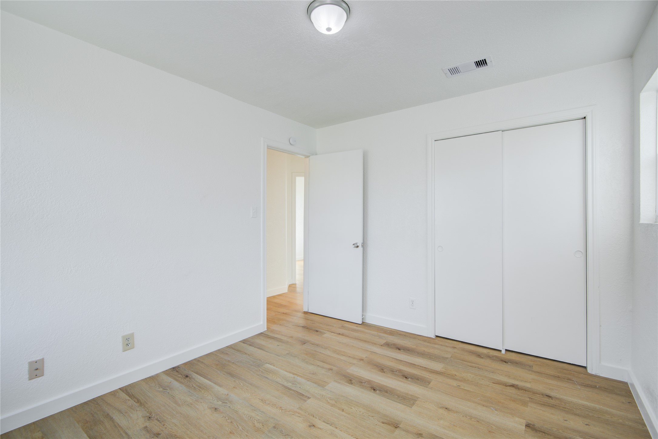 424 South Avenue B Freeport, TX 77541 - Photo 24 of 33 a view of an empty room with wooden floor