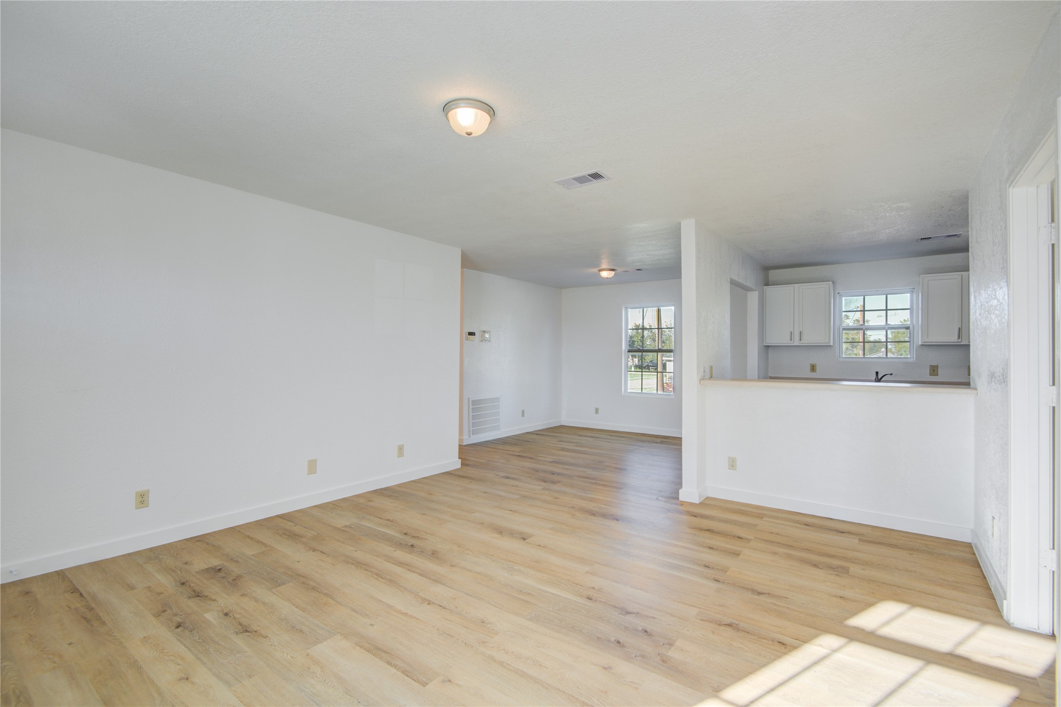 424 South Avenue B Freeport, TX 77541 - Photo 8 of 33 wooden floor in an empty room