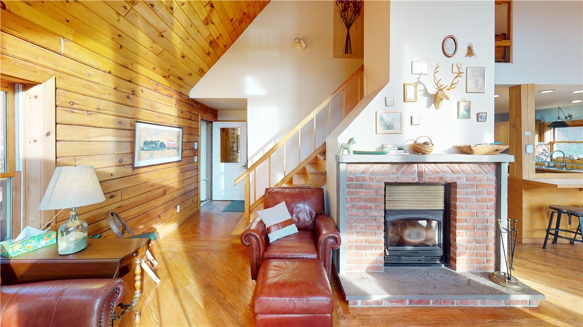 207 Pheasant Run Road Middlefield, NY 13326 - Photo 13 of 44 FP with stairs in backdrop leading to primary suit
