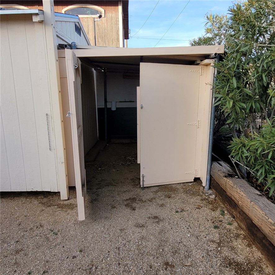 9732 2nd Street Chloride, AZ 86431 - Photo 10 of 28 This property features a structure with a pitched roof and a light-colored exterior