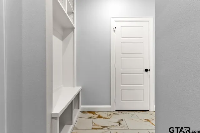 a view of cabinets and utility room with washer and dryer