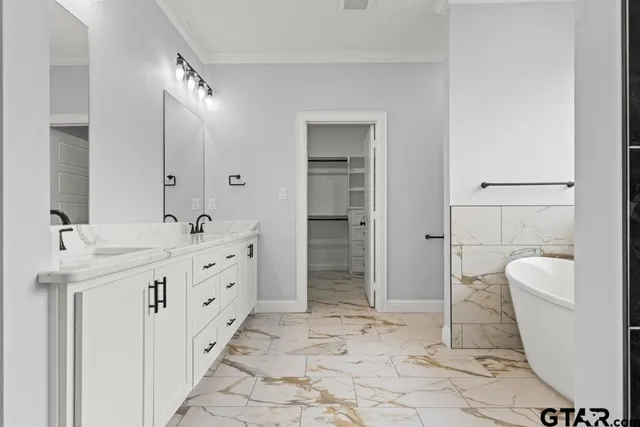 a bathroom with double sink and a mirror