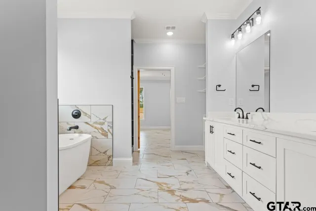 a white bath tub sitting in a bathroom