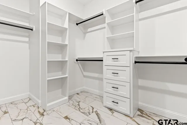 a view of an ocean with a floor to ceiling window and an entrance