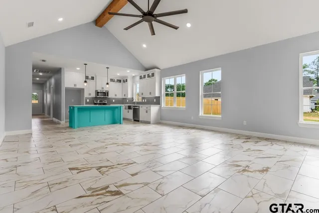 a view of a kitchen with a sink and a stove top oven