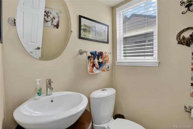 a bathroom with a toilet and a sink