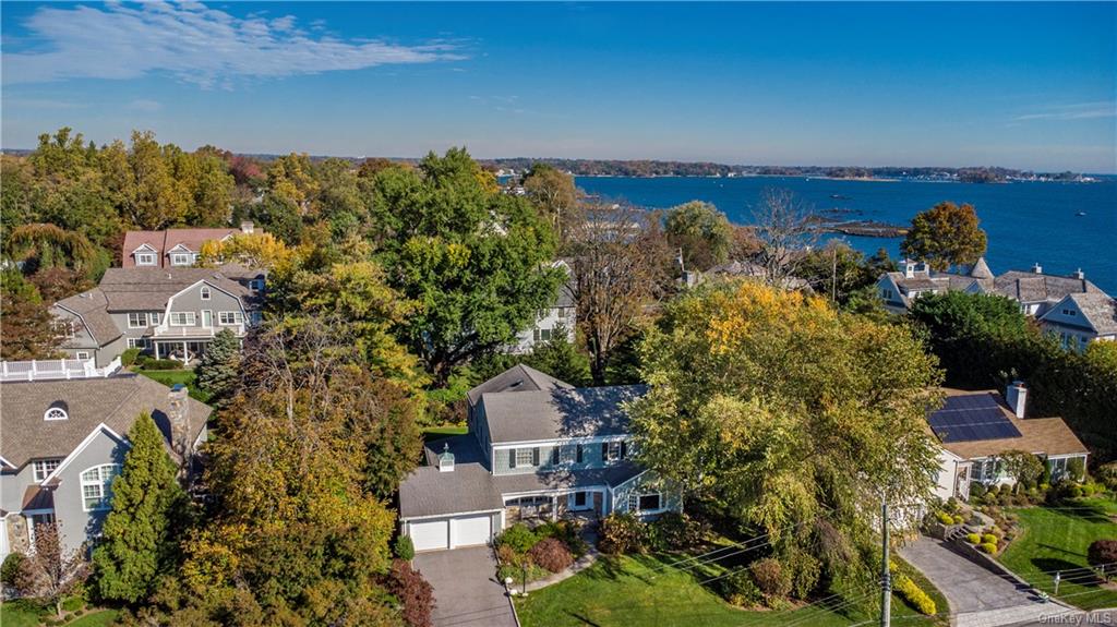 1050 Constable Drive is an updated and stunning Center Hall Colonial.  Updates include a huge eat in kitchen, adjacent family room, home office and beautiful primary suite.Walk to Long Island Sound or local Orienta beach and golf clubs. Bike to WDS, FASNY, Hommocks and MHS.
