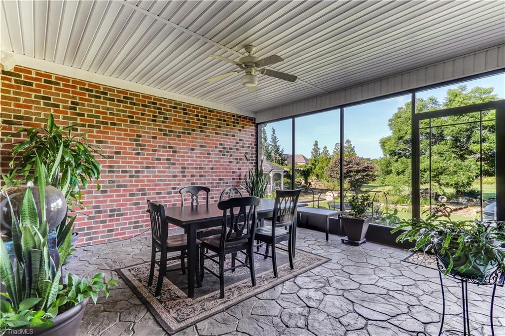 5403 Red Fox Drive Oak Ridge, NC 27310 - Photo 21 of 30 The Screened Porch may turn out to be your favorite room in the house! Stamped concrete floor, easy care ceiling, ceiling fan with light fixture, built in speakers, and sheltered on three sides.