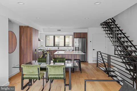 a view of a livingroom with furniture and wooden floor