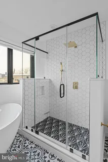 a bathroom with a sink a toilet and bathtub