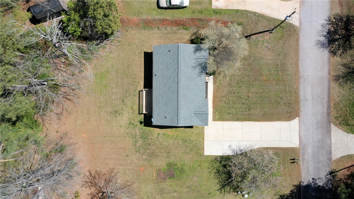 102 Roderick Drive Seneca, SC 29678 - Photo 23 of 23 An aerial view showcases a residential property with ample green space and paved access.