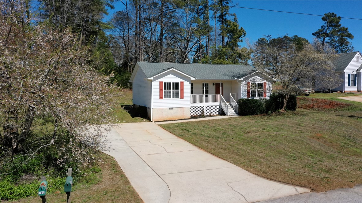 102 Roderick Drive Seneca, SC 29678 - Photo 5 of 23 This charming bungalow offers a welcoming porch and a spacious driveway, perfect for comfortable living.