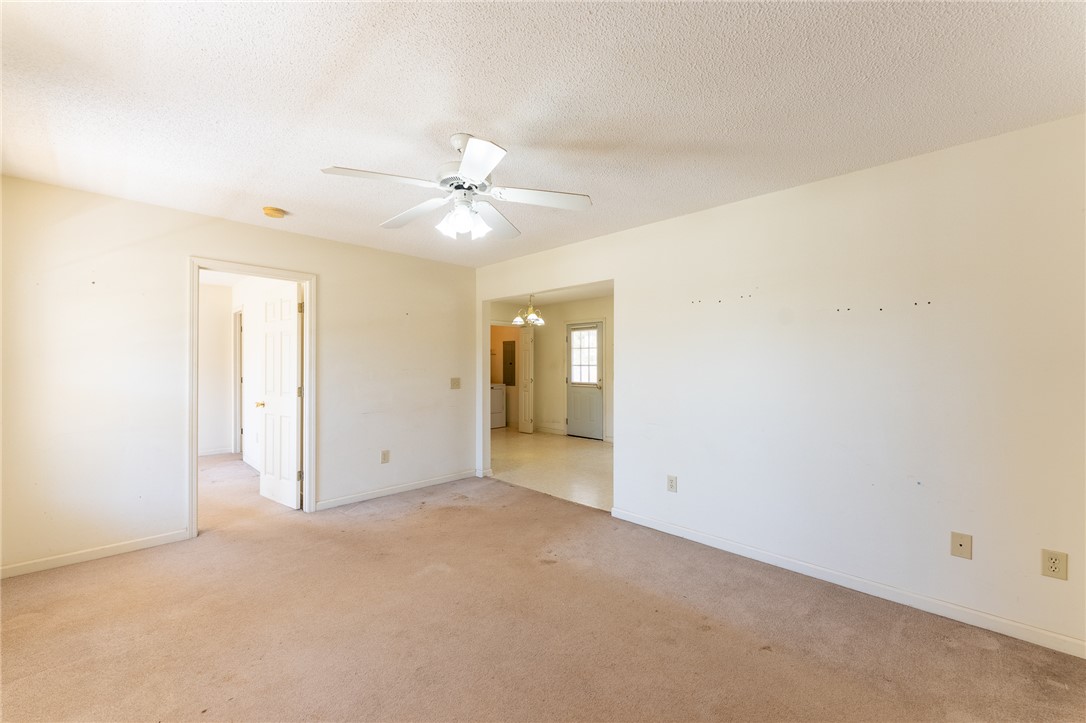 102 Roderick Drive Seneca, SC 29678 - Photo 6 of 23 This versatile living space offers comfortable carpeting and a bright ceiling fan.
