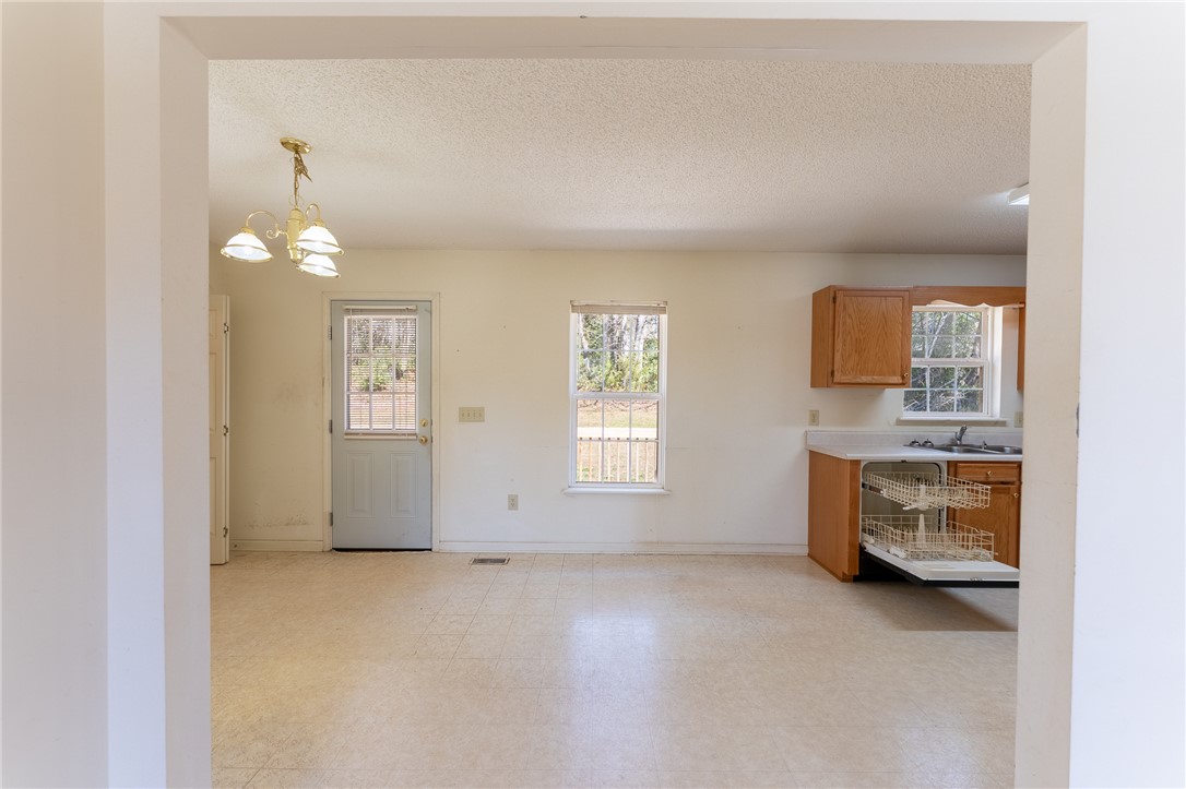 102 Roderick Drive Seneca, SC 29678 - Photo 8 of 23 This bright kitchen offers a functional layout with natural light and easy access to the outdoors.