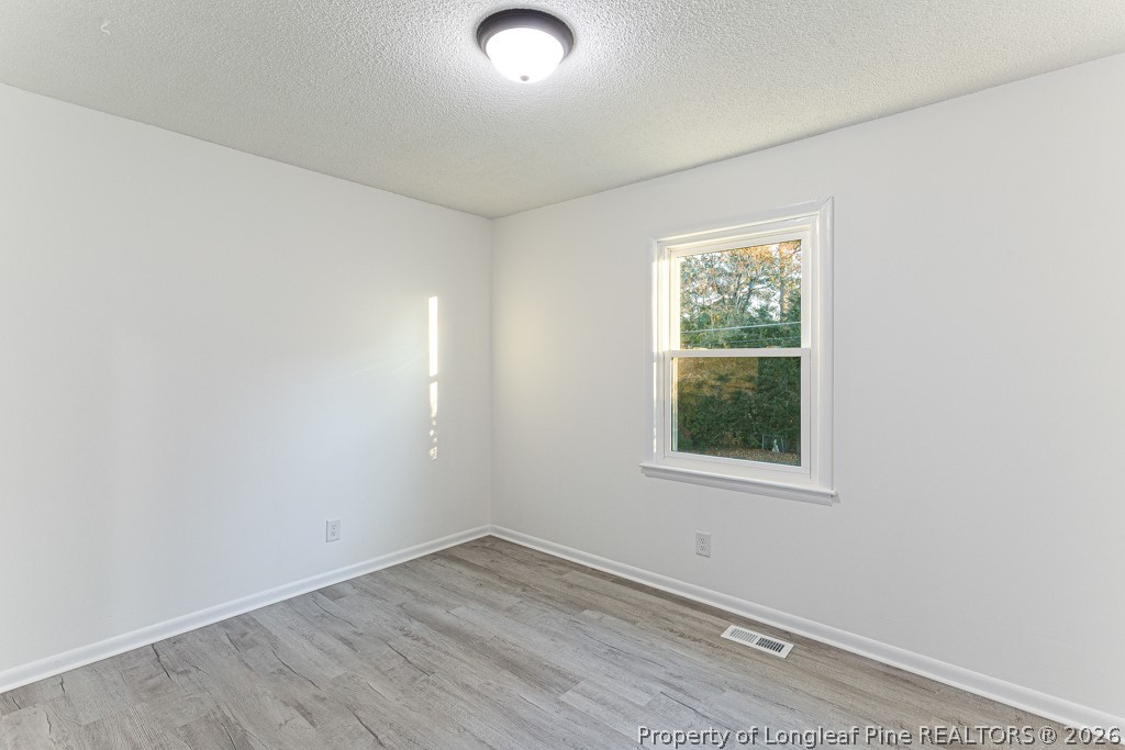922 Rancho Drive Fayetteville, NC 28303 - Photo 17 of 21 an empty room with a window