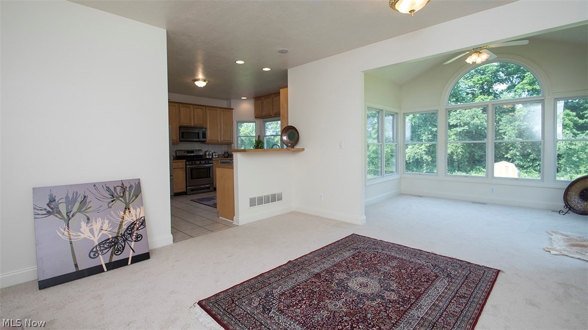 3847 Royal Rock Road Akron, OH 44321 - Photo 11 of 29 Just off the kitchen, the family room with newer paint and carpet.