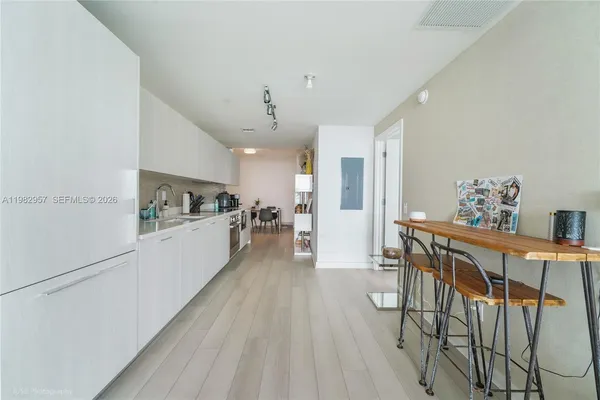 a view of kitchen and dining room with furniture