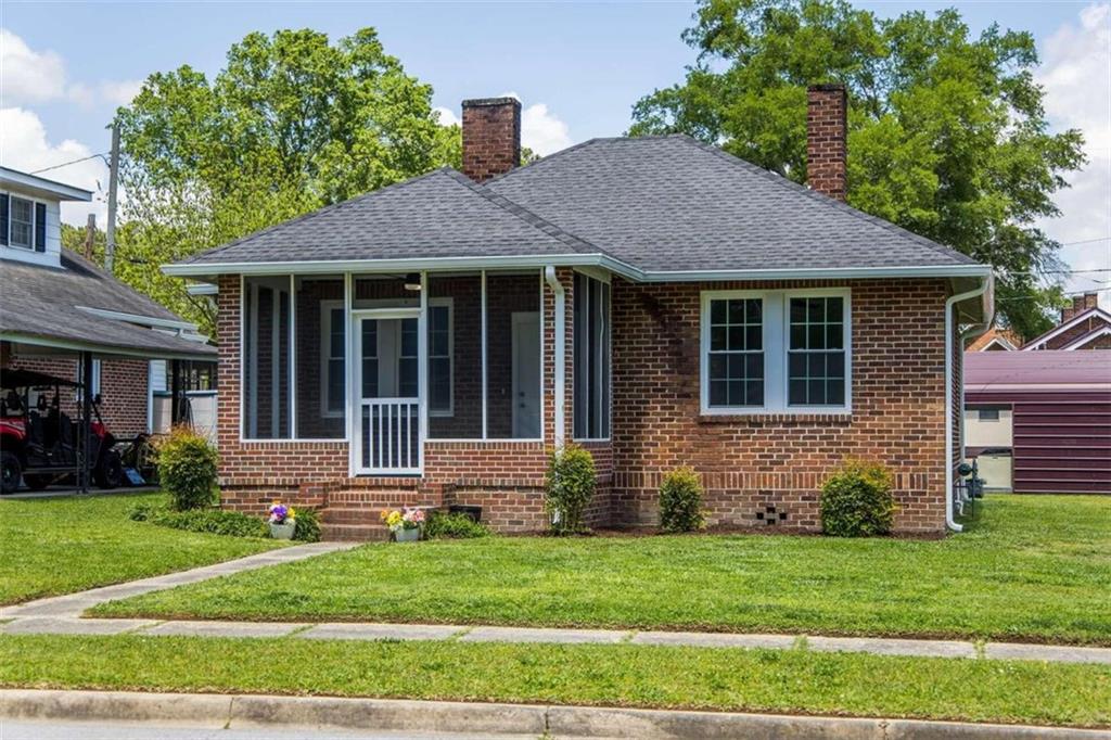 10 Green Street Northeast Rome, GA 30161 - Photo 1 of 1 a front view of a house with a yard