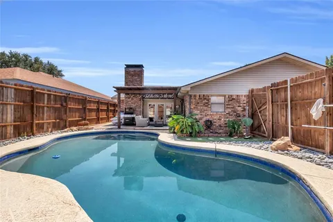 a view of a house with swimming pool