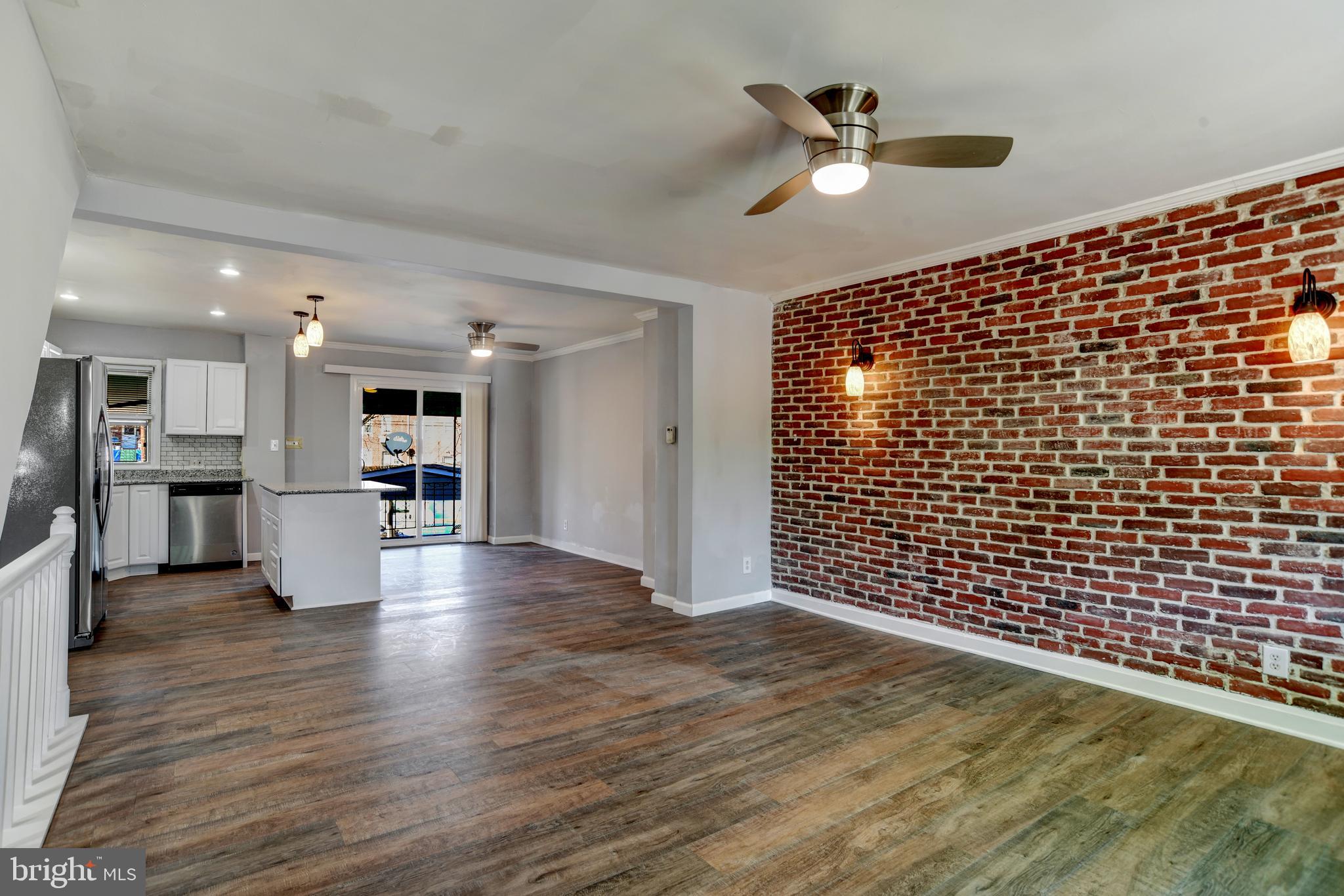 4240 Flowerton Road Baltimore, MD 21229 - Photo 27 of 28 Open floor-plan. Living room with exposed brick.