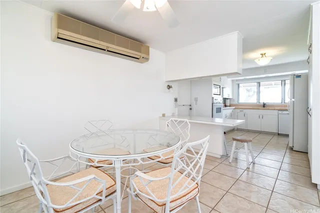 a dining room with a table and chairs