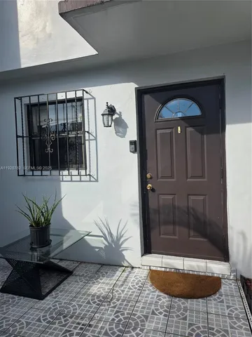 a view of a hallway with a potted plant