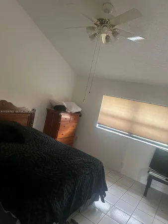 a bedroom with a bed and walk in closet