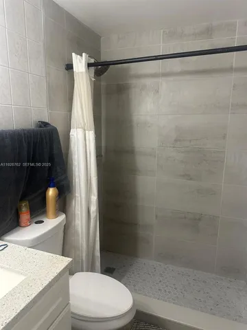 a close view of stove and cabinets