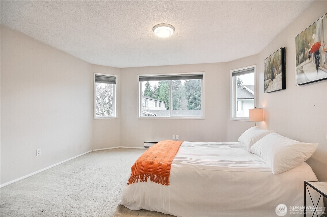 4514 Southwest 319th Place, Unit D Federal Way, WA 98023 - Photo 16 of 21 a bedroom with a bed and a window