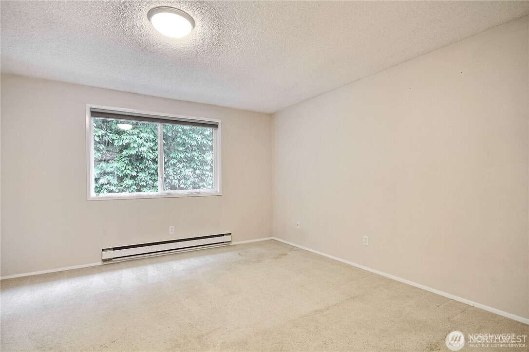 4514 Southwest 319th Place, Unit D Federal Way, WA 98023 - Photo 20 of 21 an empty room with a window