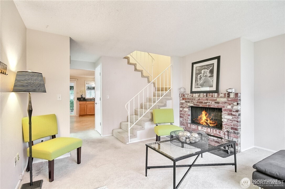 4514 Southwest 319th Place, Unit D Federal Way, WA 98023 - Photo 7 of 21 a living room with furniture and a fireplace