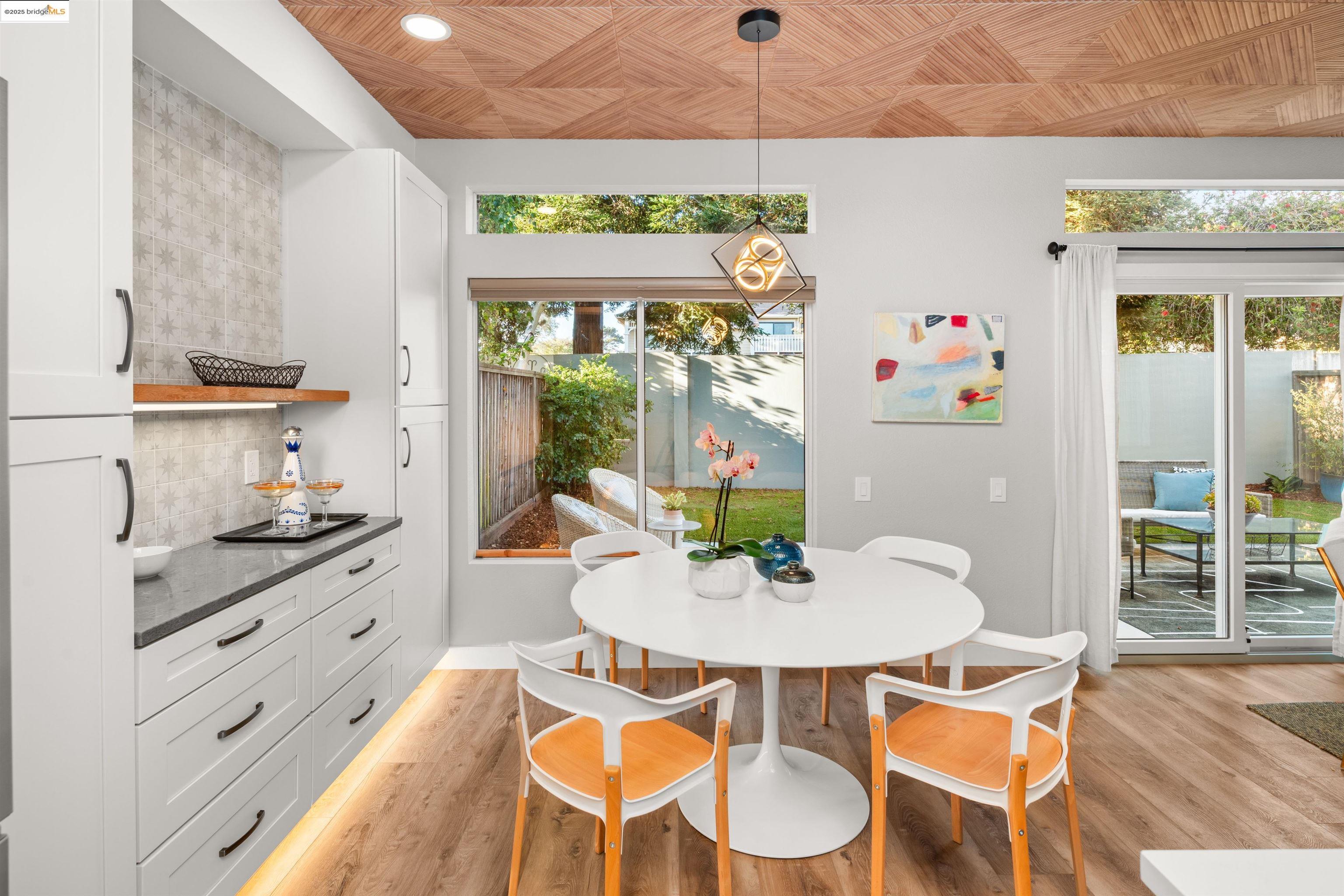 35 Southwind Circle Richmond, CA 94804 - Photo 23 of 59 a view of a dining room with furniture a chandelier and wooden floor